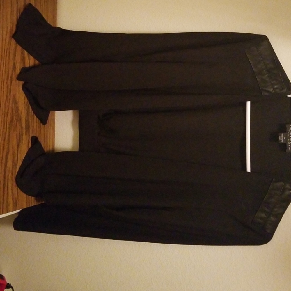 A black blazer with zippers in the back